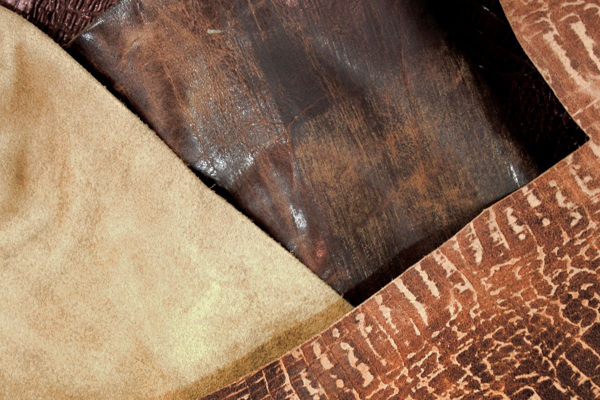 Close view of full-grain leather texture on a handbag